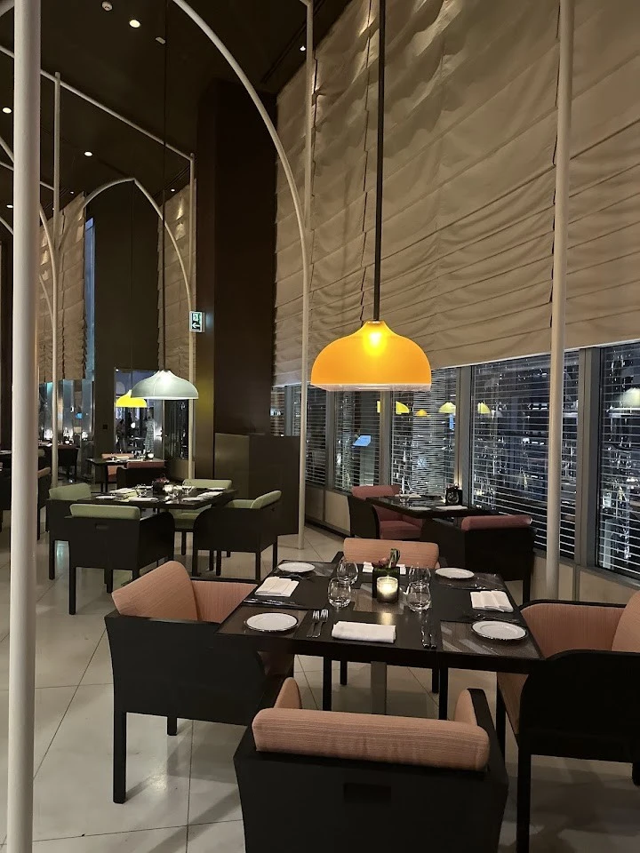 Chic dining setup at Amal Restaurant, Armani Hotel, Dubai.
