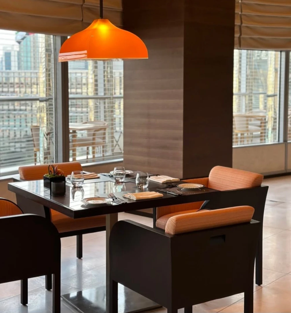 Elegant dining setup at Amal Restaurant, Armani Hotel, Burj Khalifa, Dubai.
