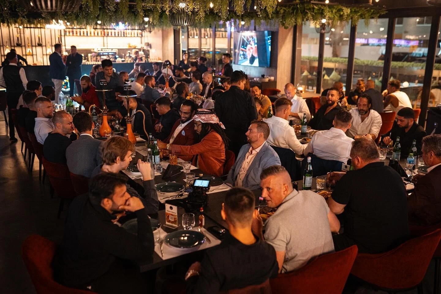 Crowded dinner event at Charcoal Garden Restaurant, Dubai Media City.