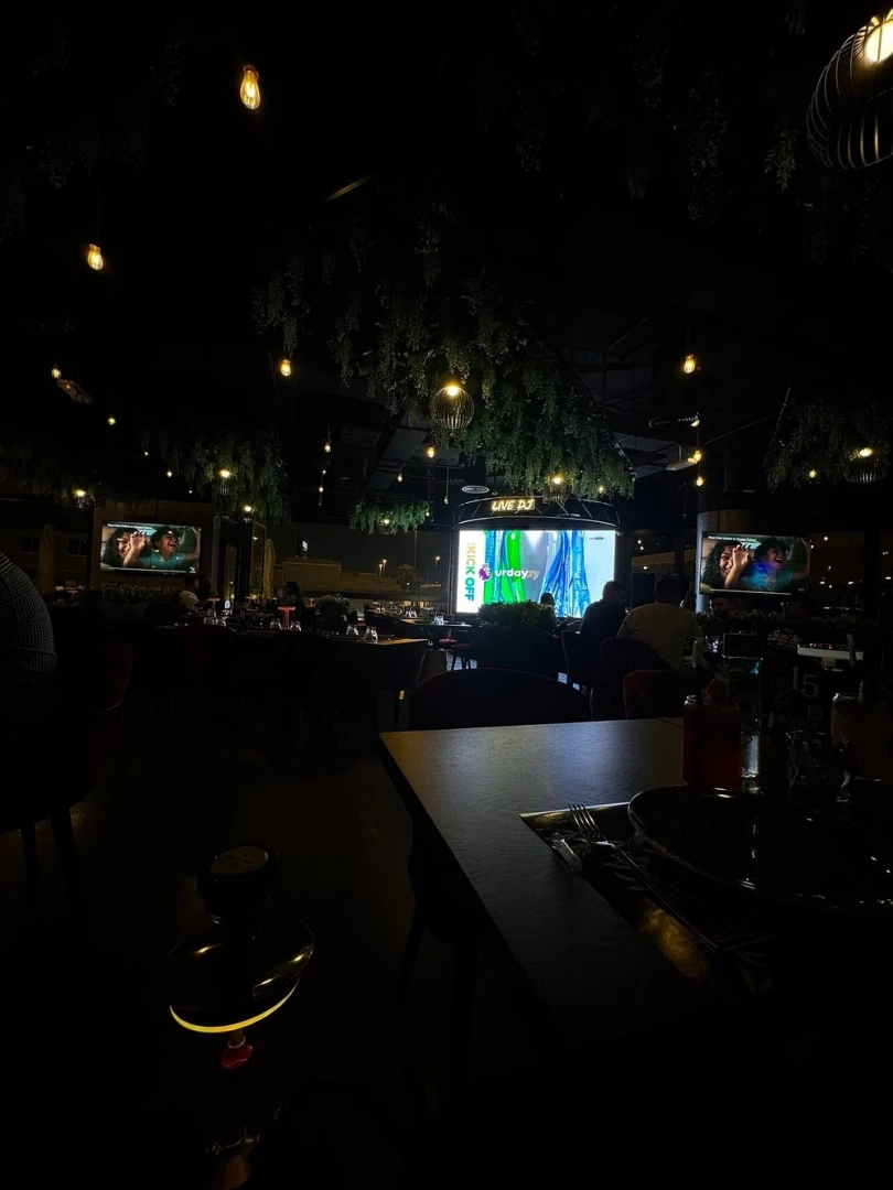 Dimly lit Charcoal Garden Restaurant & Cafe in Dubai Media City