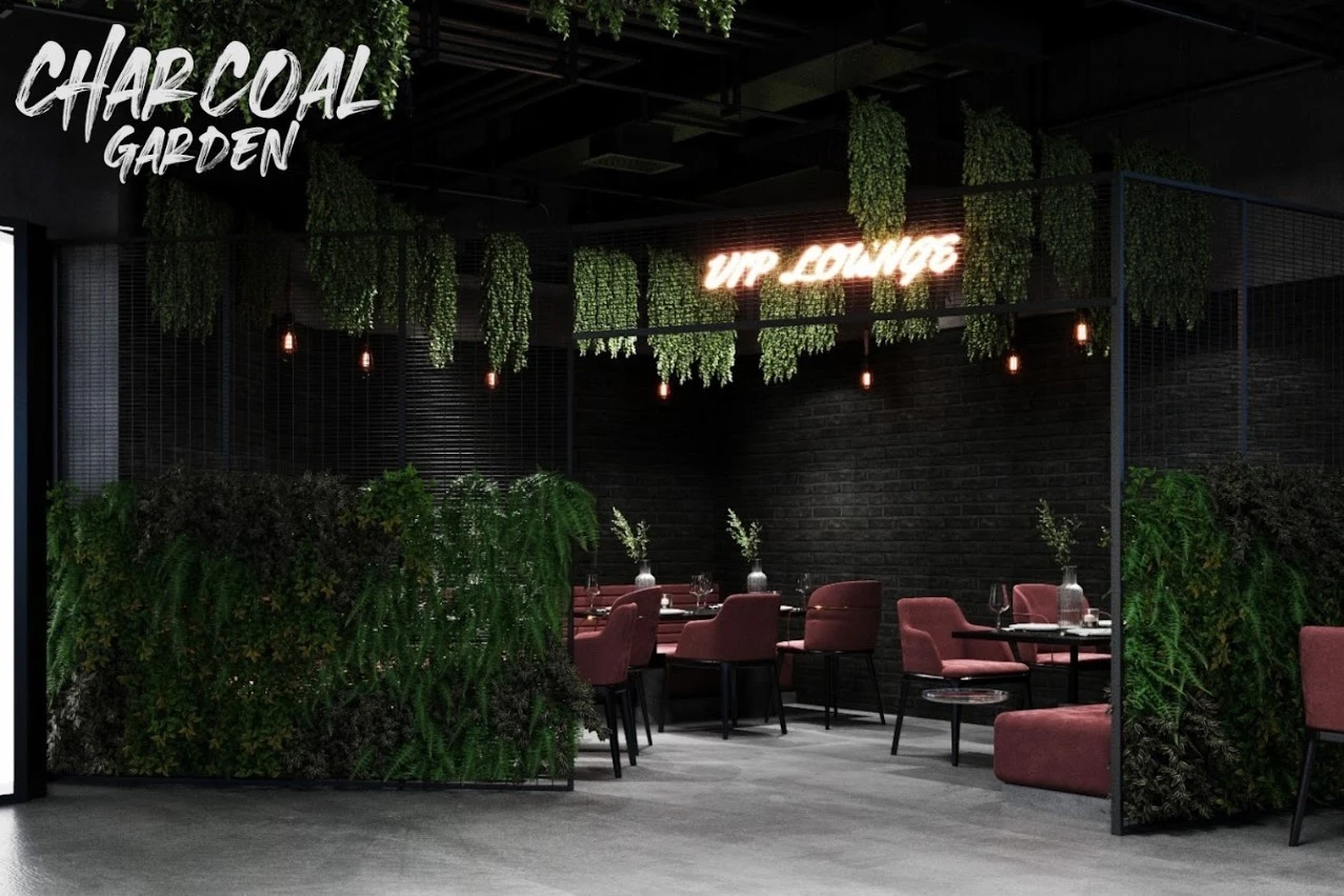 Charcoal Garden VIP Lounge with greenery and seating, Dubai Media City.
