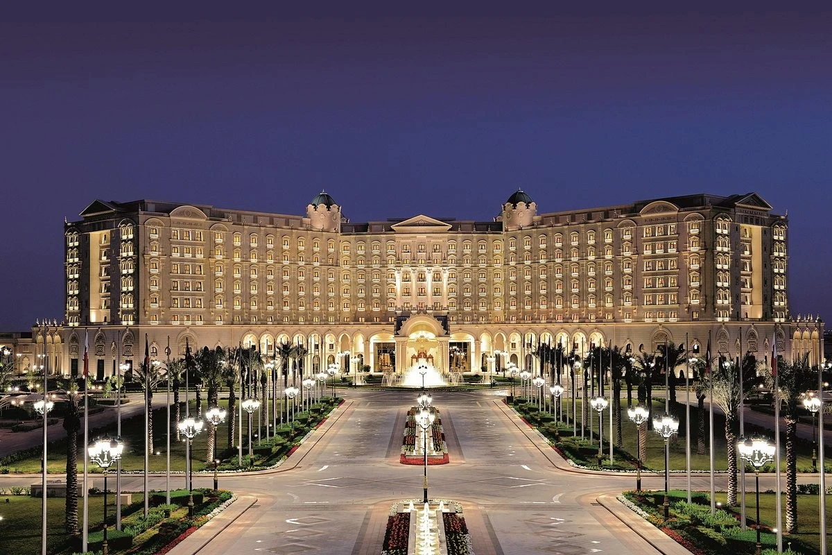 The Ritz Carlton Riyadh illuminated at night, grand entrance view.
