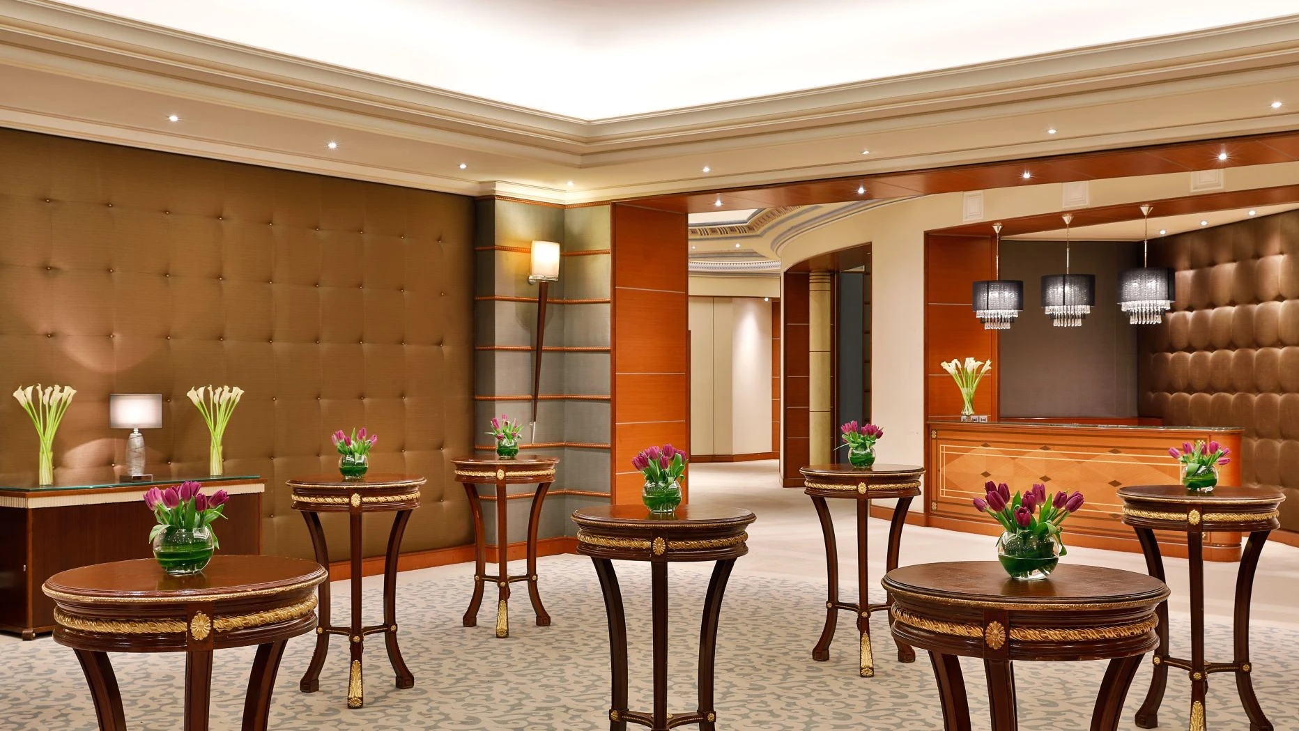 Elegant lobby with floral arrangements, The Ritz Carlton Riyadh.
