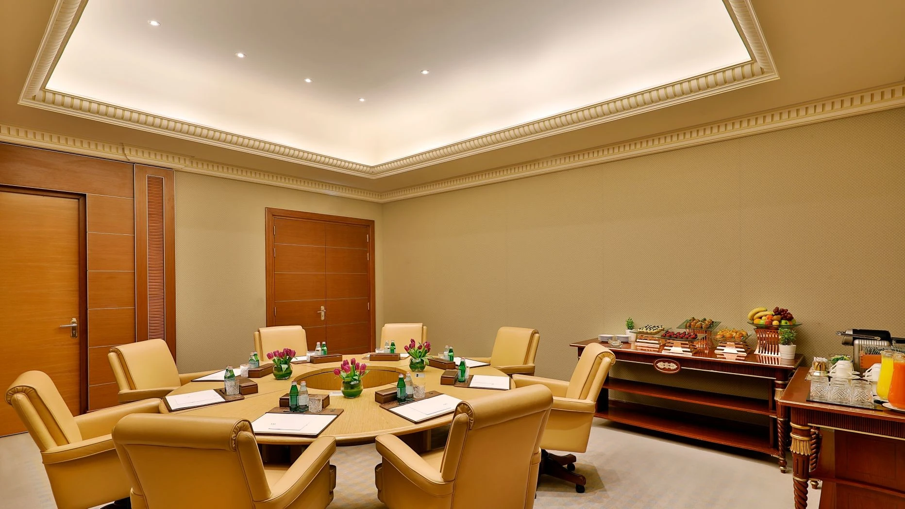 Elegant meeting room at The Ritz Carlton Riyadh with refreshments.