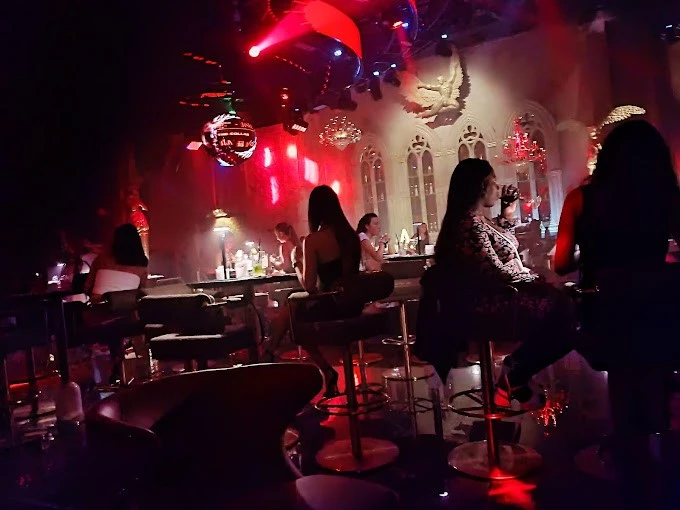 Dimly lit Vice Night Club in Downtown Dubai with patrons seated.