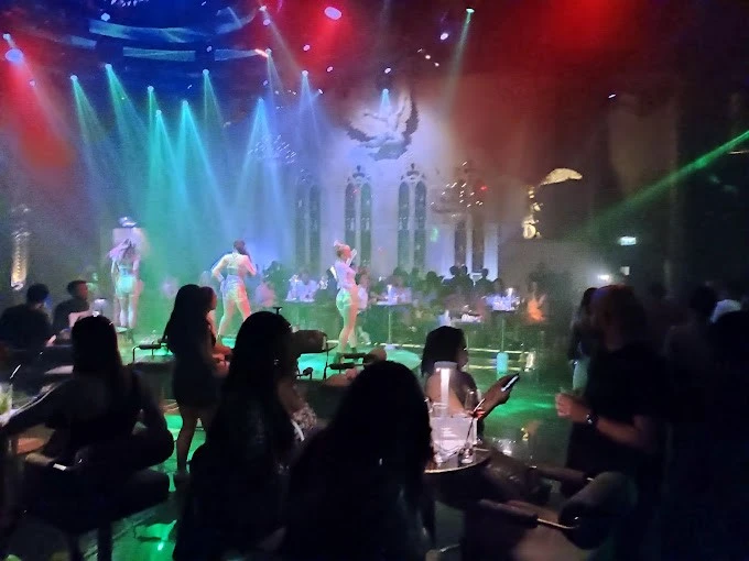 Dancers performing at Vice Night Club, Downtown Dubai, vibrant lights.