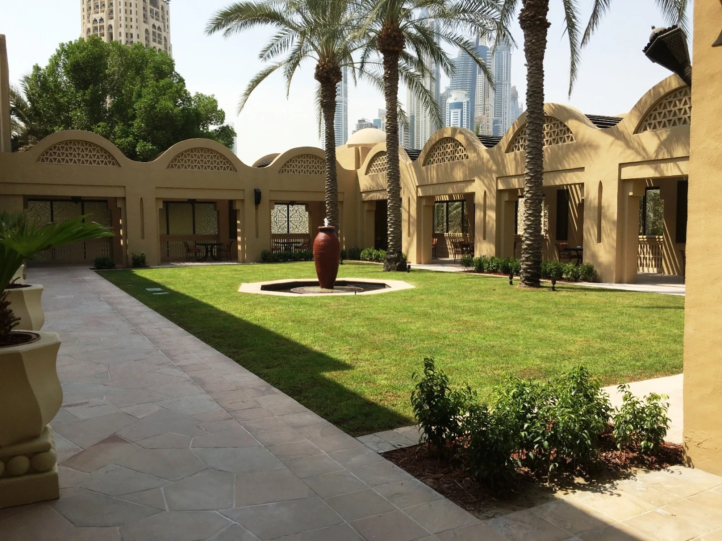 Courtyard with palm trees at One&Only Royal Mirage, Dubai.