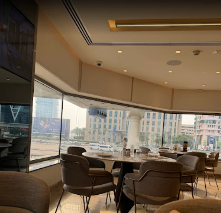 Interior of Al Safadi Restaurant DIFC, Dubai with city view.