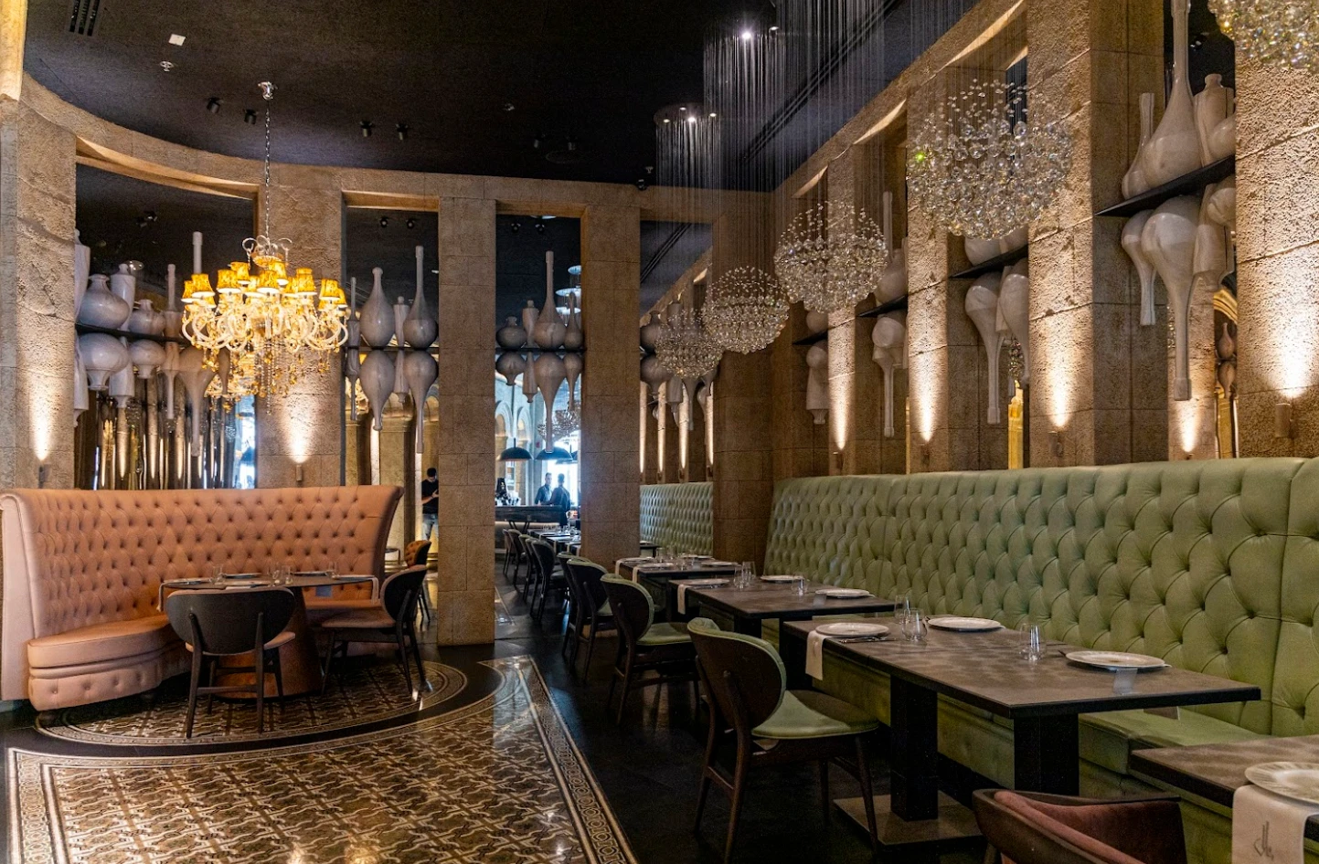 Elegant interior of Babel Dubai Restaurant Downtown with chandeliers and plush seating.