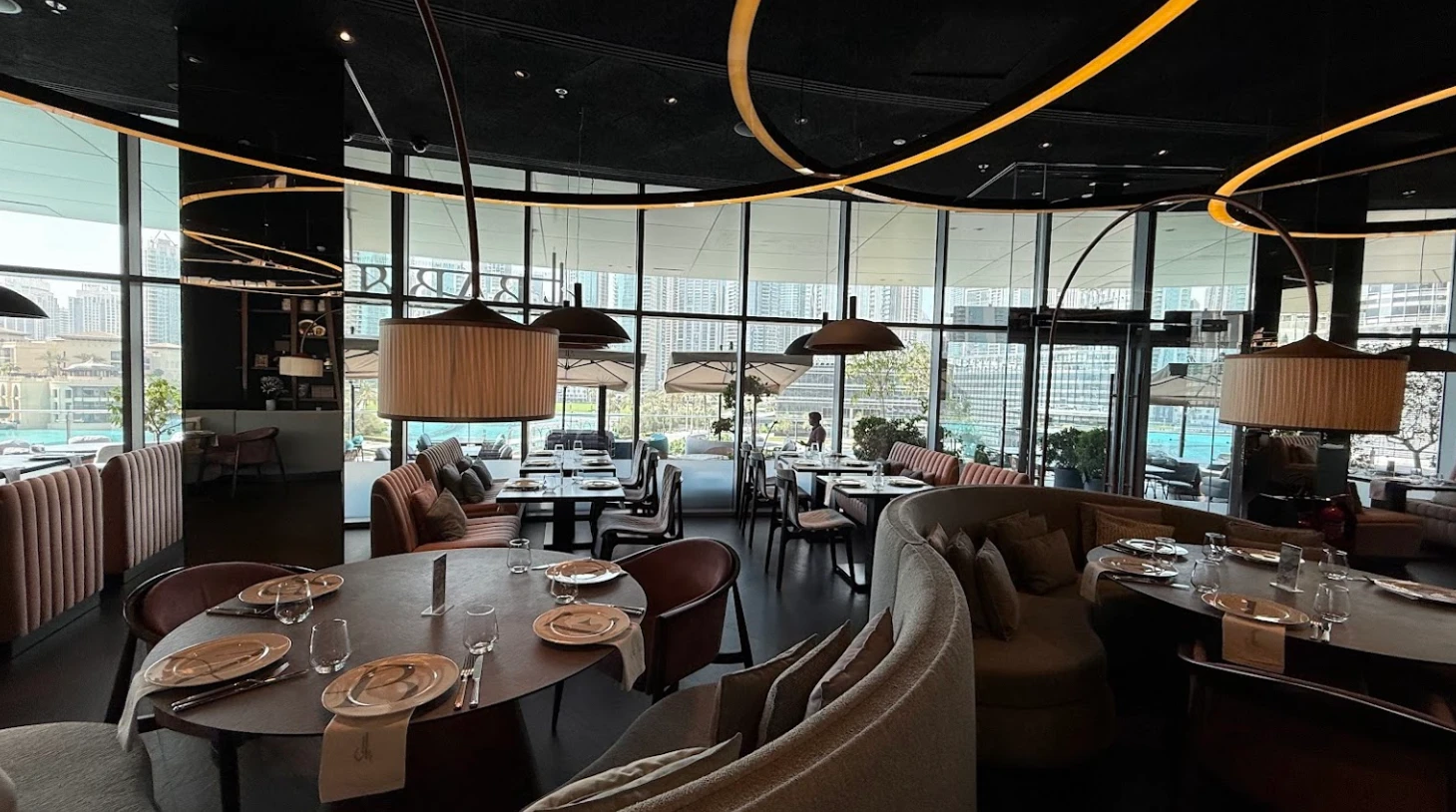 Elegant dining area at Babel Dubai Restaurant Downtown, with city view.
