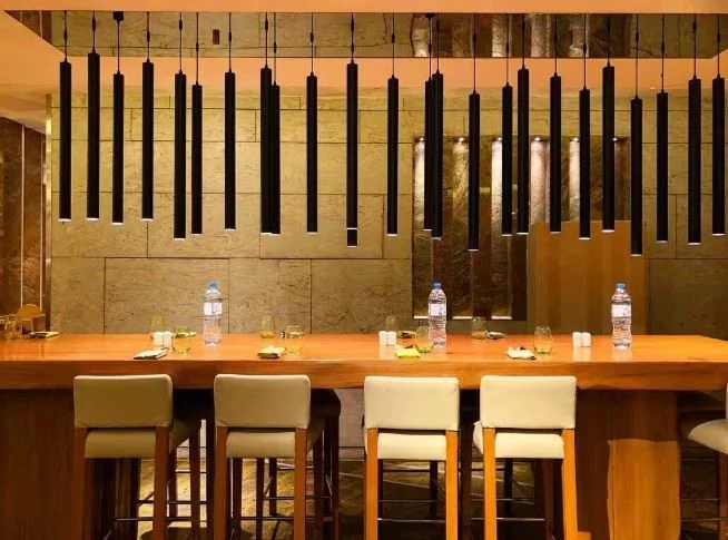 Elegant dining area at Kitchen 6 Restaurant, Dubai with modern lighting.