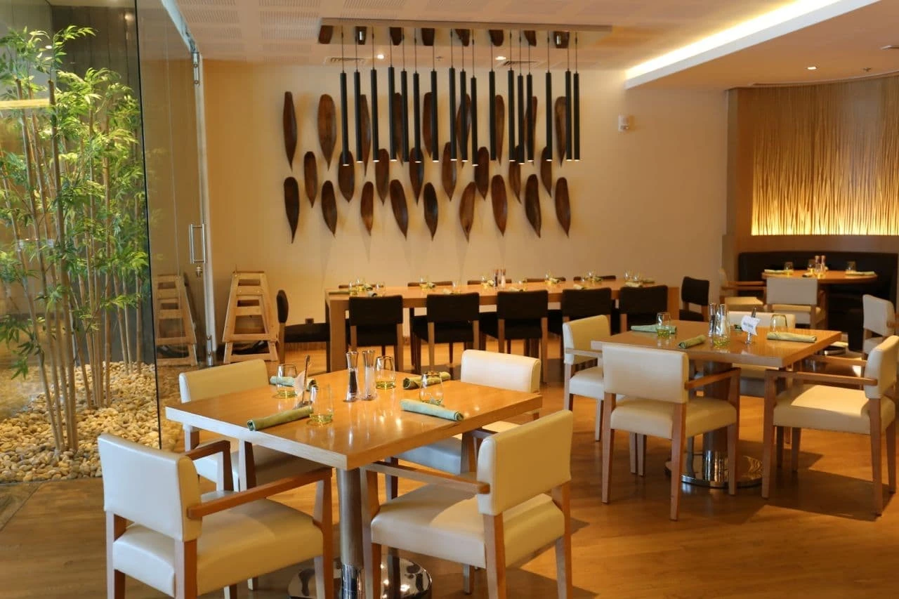 Contemporary dining space with decorative wall art at Kitchen 6, Dubai.