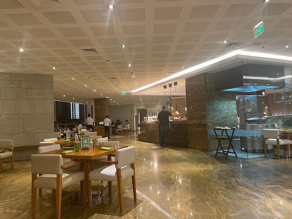 Chic dining area with marble floors at Kitchen 6, Dubai.