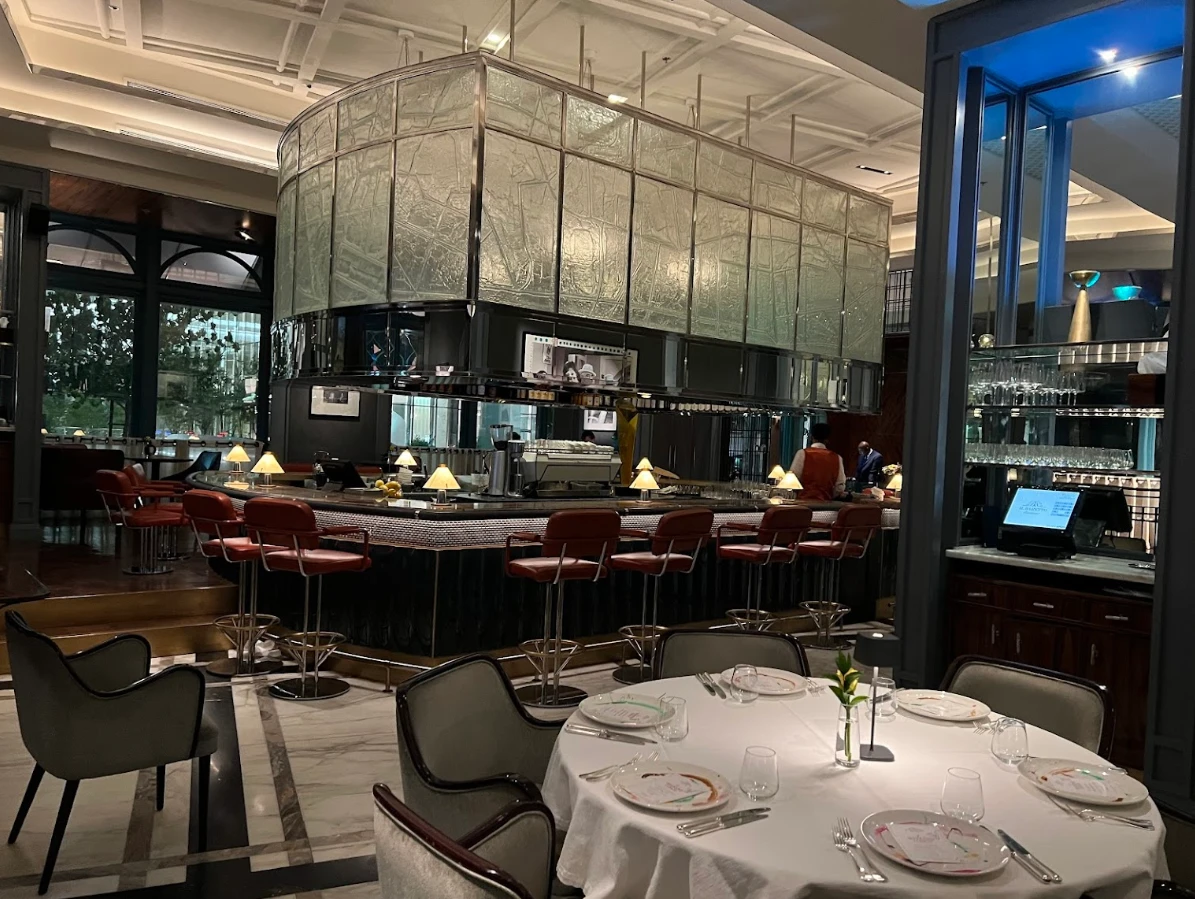 Elegant dining area at Il Baretto Restaurant, Riyadh with bar seating.