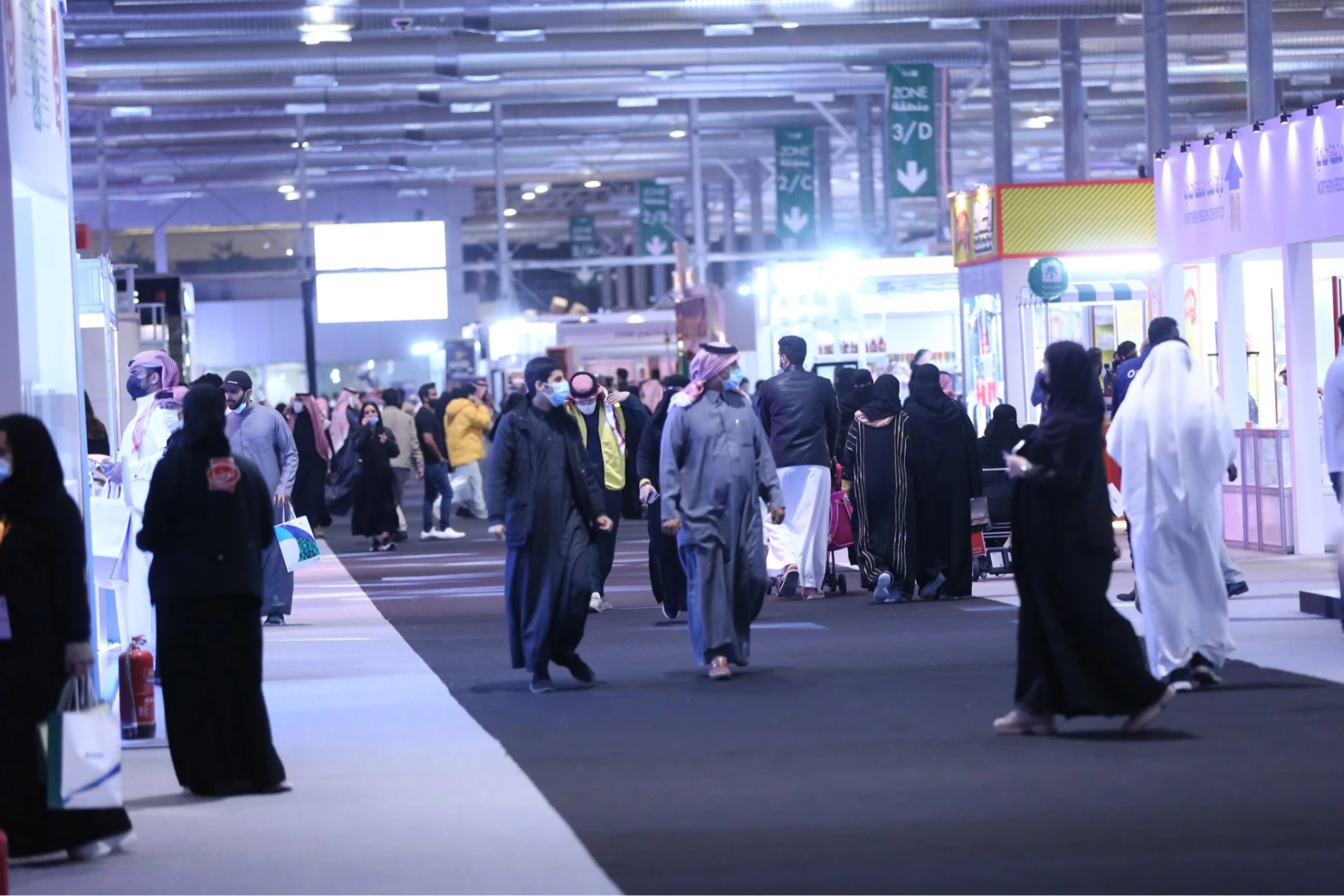 Crowd at Riyadh Front Exhibition Conference Center, bustling indoor event.