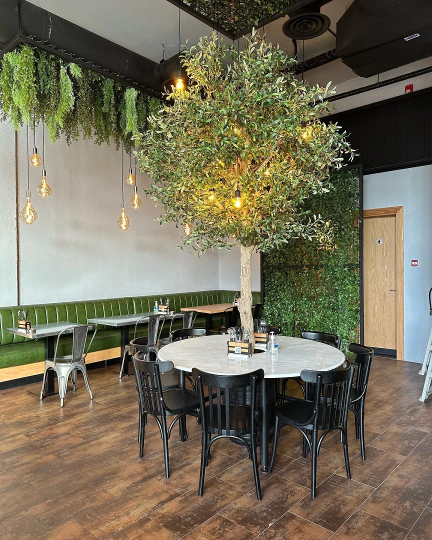 Swiss Butter Le Mall Jeddah, stylish interior with greenery and lights.