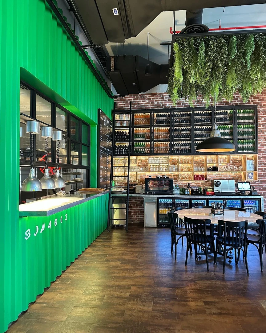 Swiss Butter Le Mall Jeddah, industrial decor with green accents.