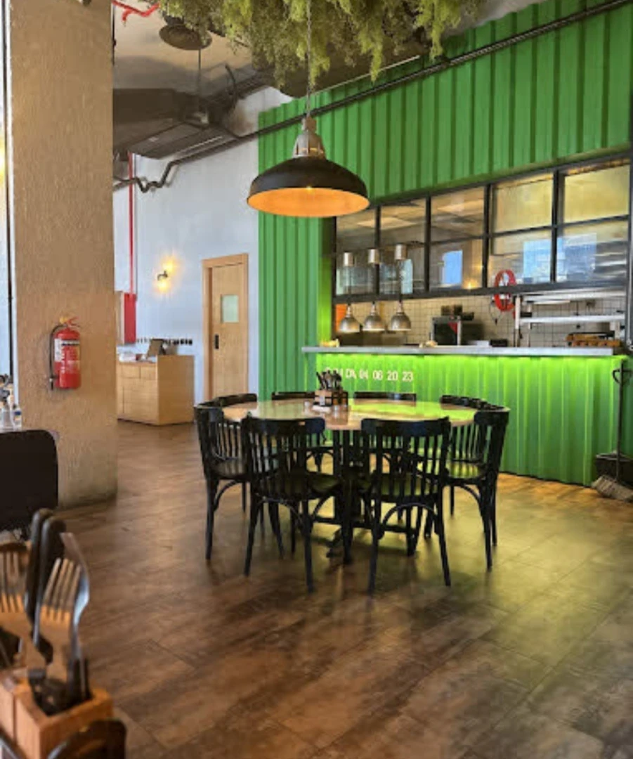Swiss Butter Le Mall Jeddah, cozy dining area with green decor.