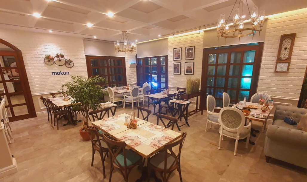 Warm dining space with elegant decor at Makan, Jeddah.