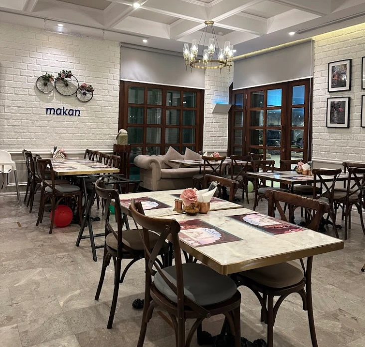 Chic dining area with floral decor at Makan, Jeddah.