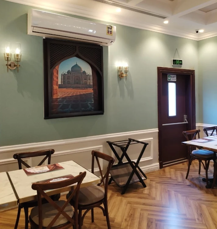 Makan Indian Restaurant Jeddah interior with Taj Mahal artwork.