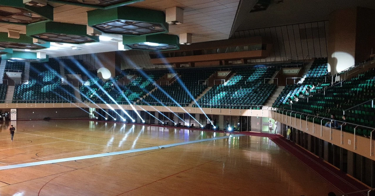 Indoor arena with spotlight beams, Prince Abdullah Al Faisal Sports City, Jeddah.