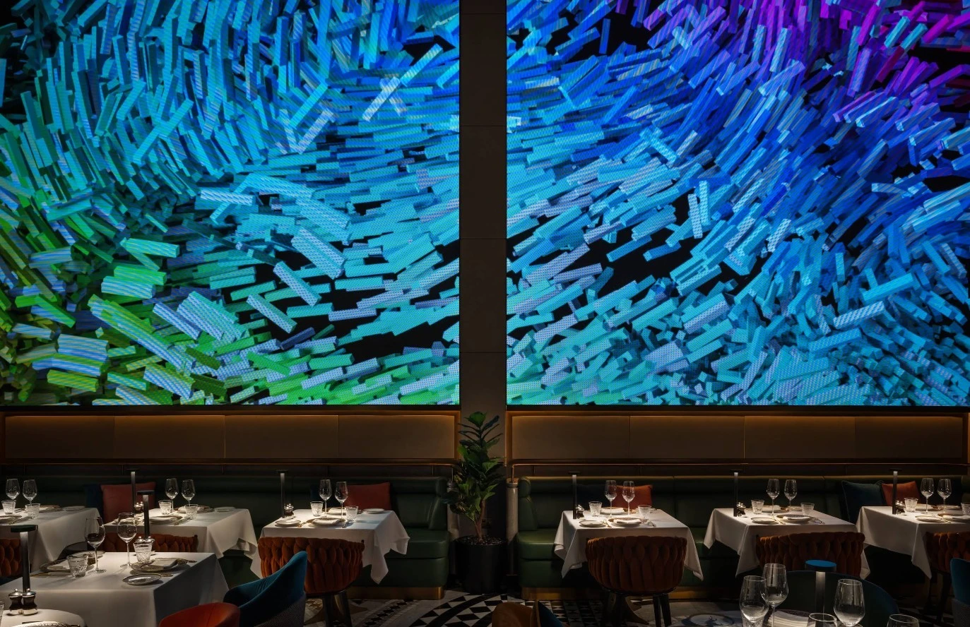 Zenon Restaurant Dubai, elegant dining area with vibrant abstract wall art.