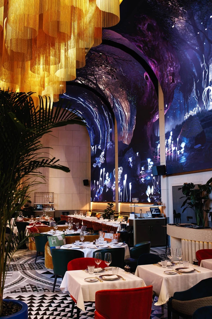 Elegant dining area with artistic ceiling at Zenon Restaurant Dubai.