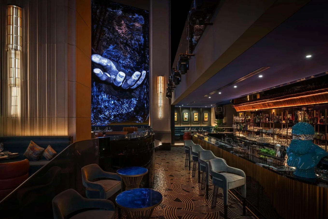 Elegant interior of Zenon Restaurant Dubai with modern art and bar.