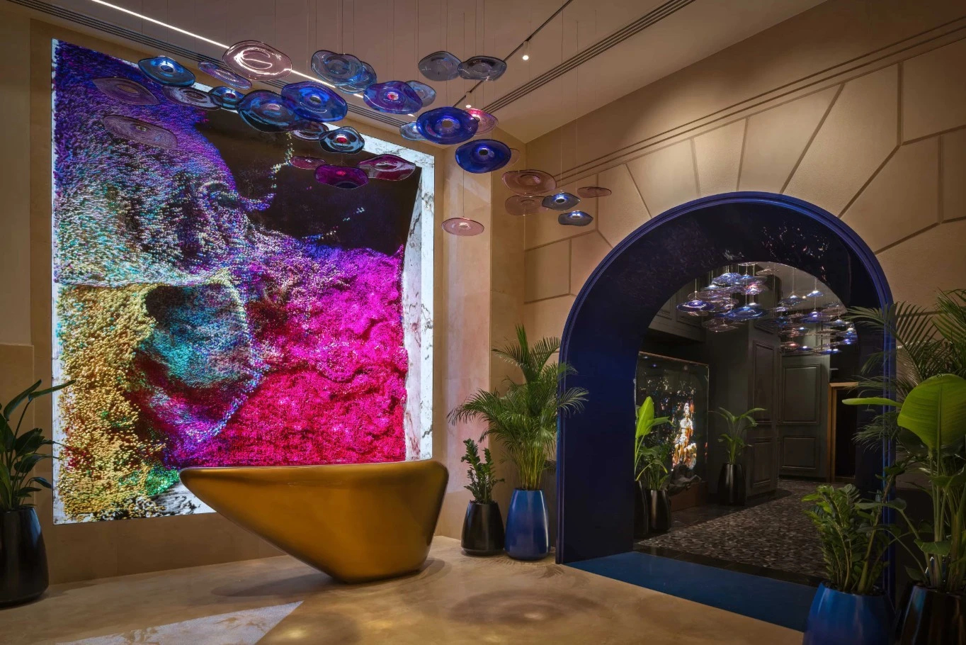 Colorful abstract wall art at Zenon Restaurant Dubai entrance.