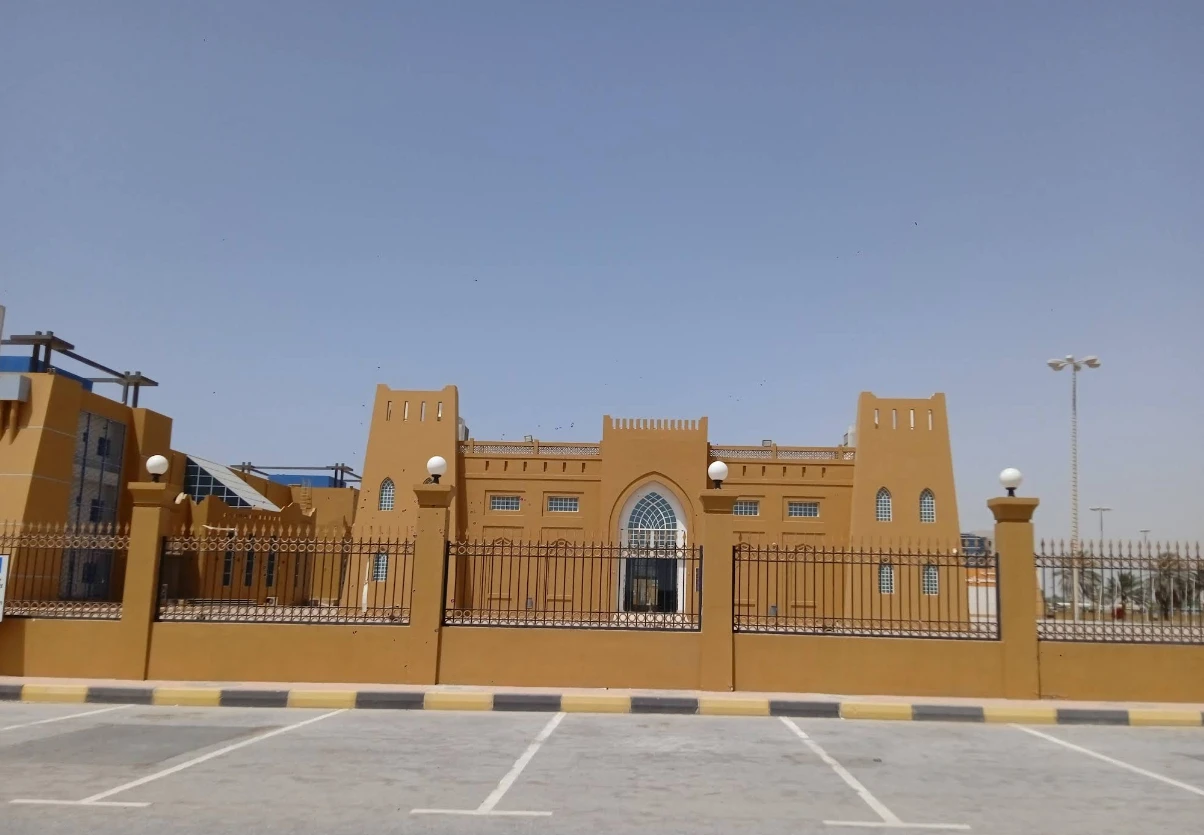 Rak Expo Center facade, Ras Al-Khaimah, clear sky background.