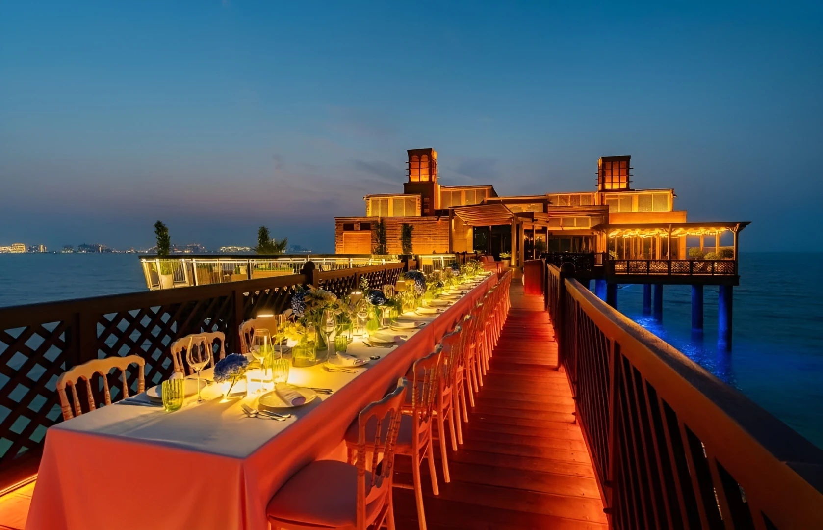 Elegant dining setup at Pierchic Restaurant, Dubai, over the water.