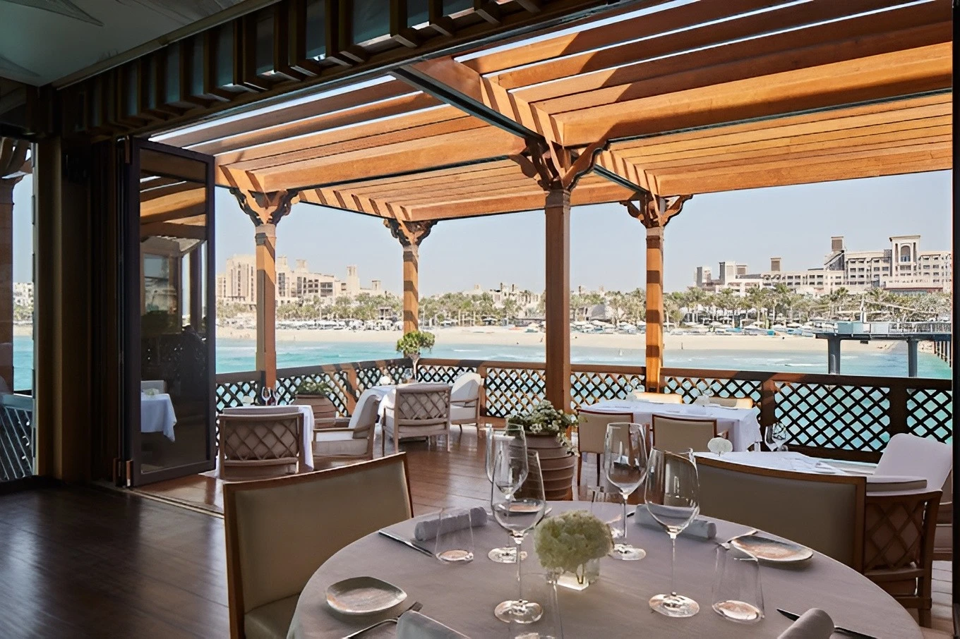 Pierchic Restaurant Dubai terrace with sea view and elegant dining setup.