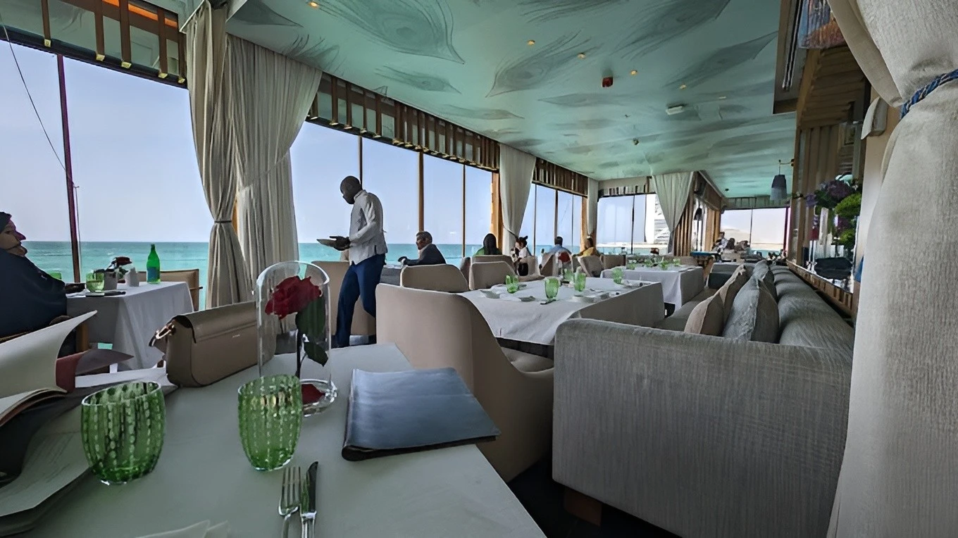 Elegant dining area at Pierchic Restaurant Dubai with sea view.
