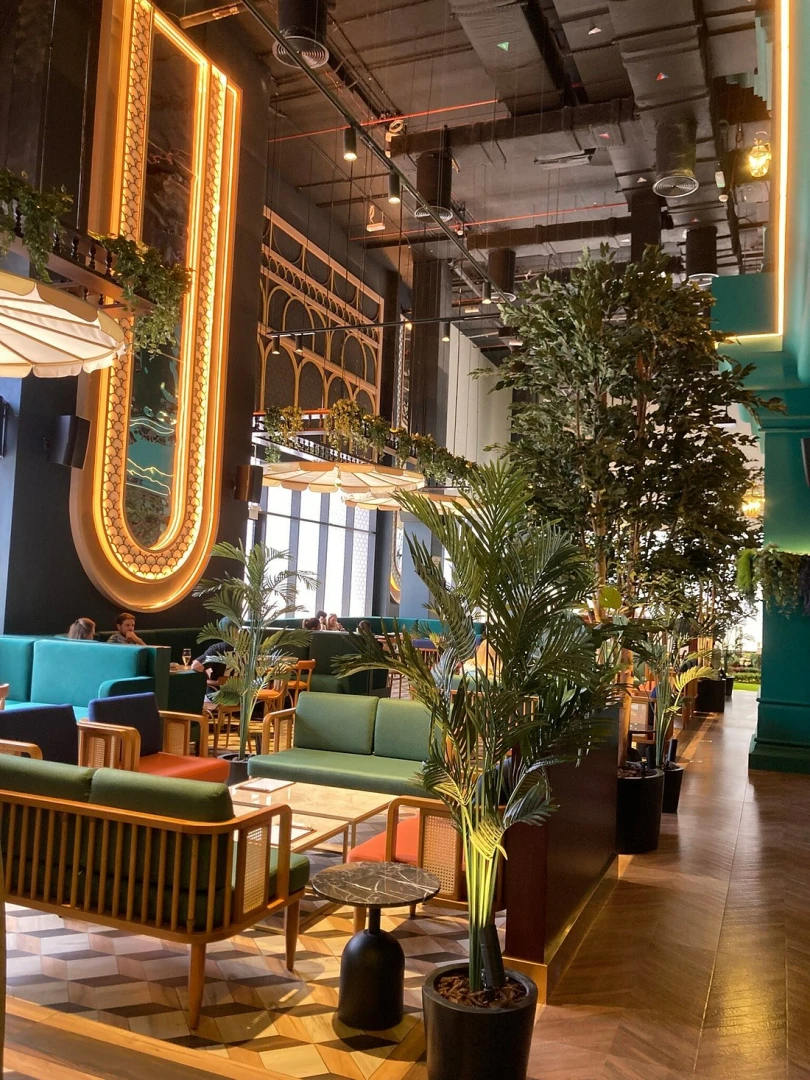 Stylish seating area at Swingers The Crazy Golf Club Dubai.