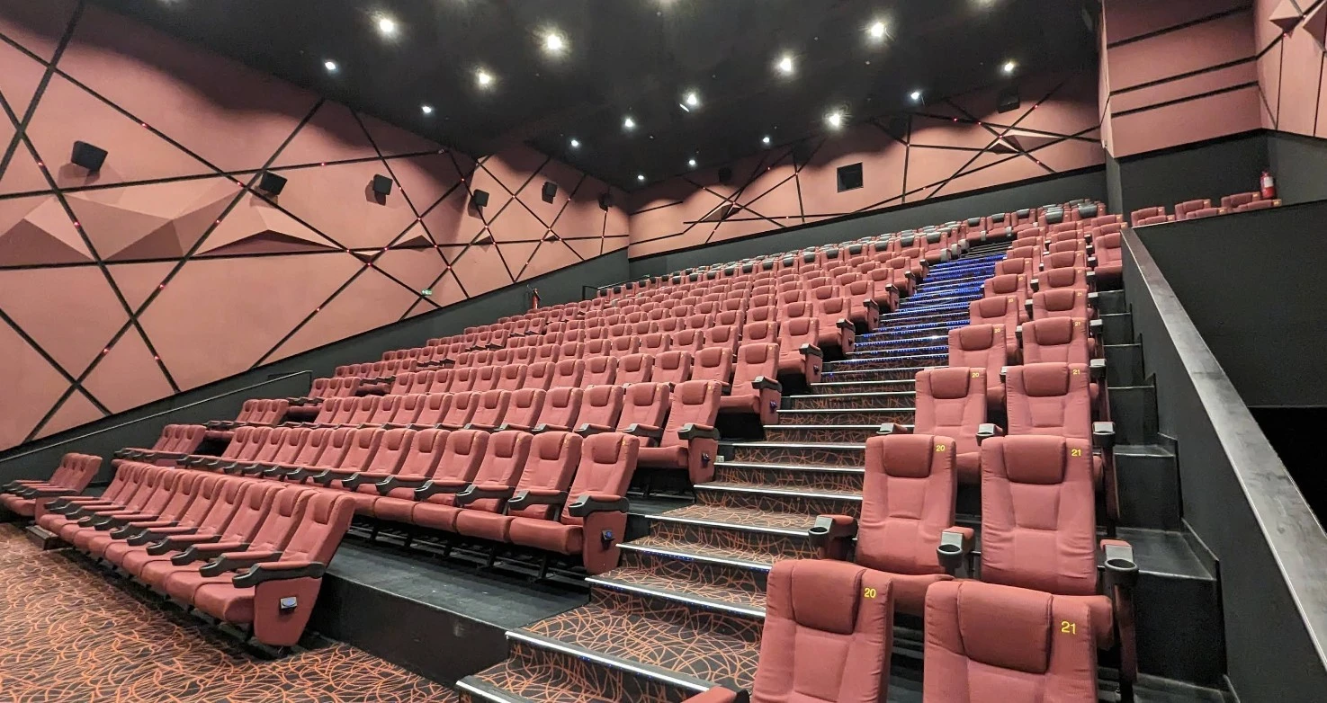 Novo Cinemas The Pearl Doha, empty theater with red seats.