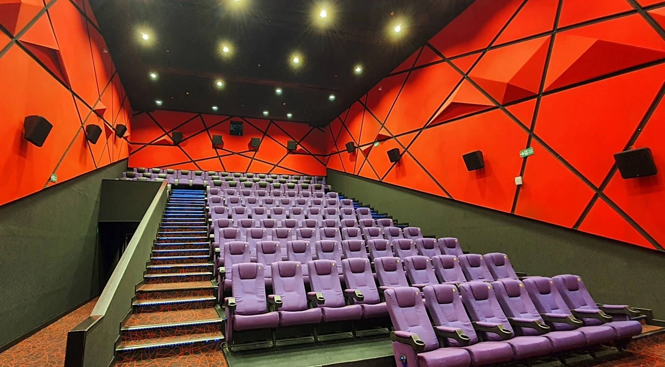Novo Cinemas The Pearl Doha auditorium with purple seats and red walls.