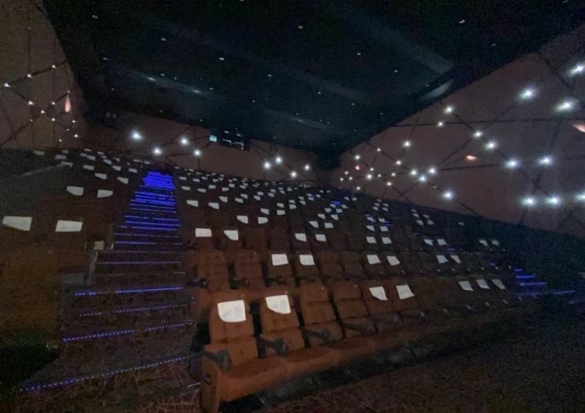 Novo Cinemas The Pearl Doha auditorium with illuminated seats and stairs.