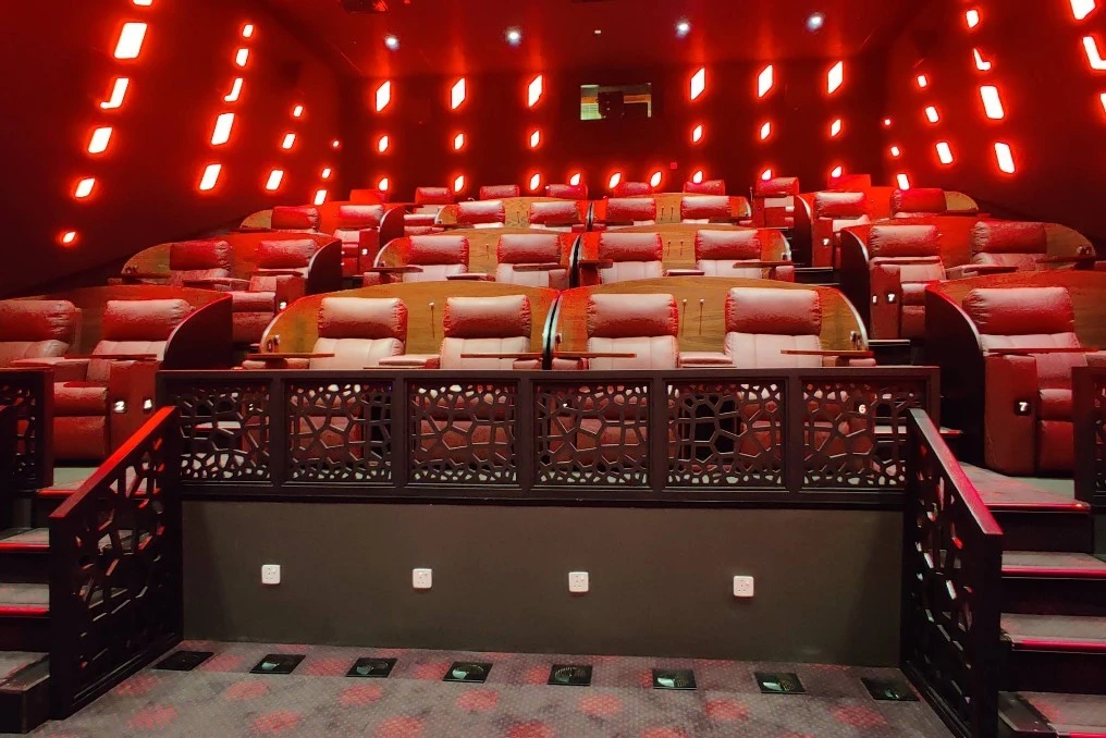 Luxurious seating at Novo Cinemas Msheireb Doha with red lighting.