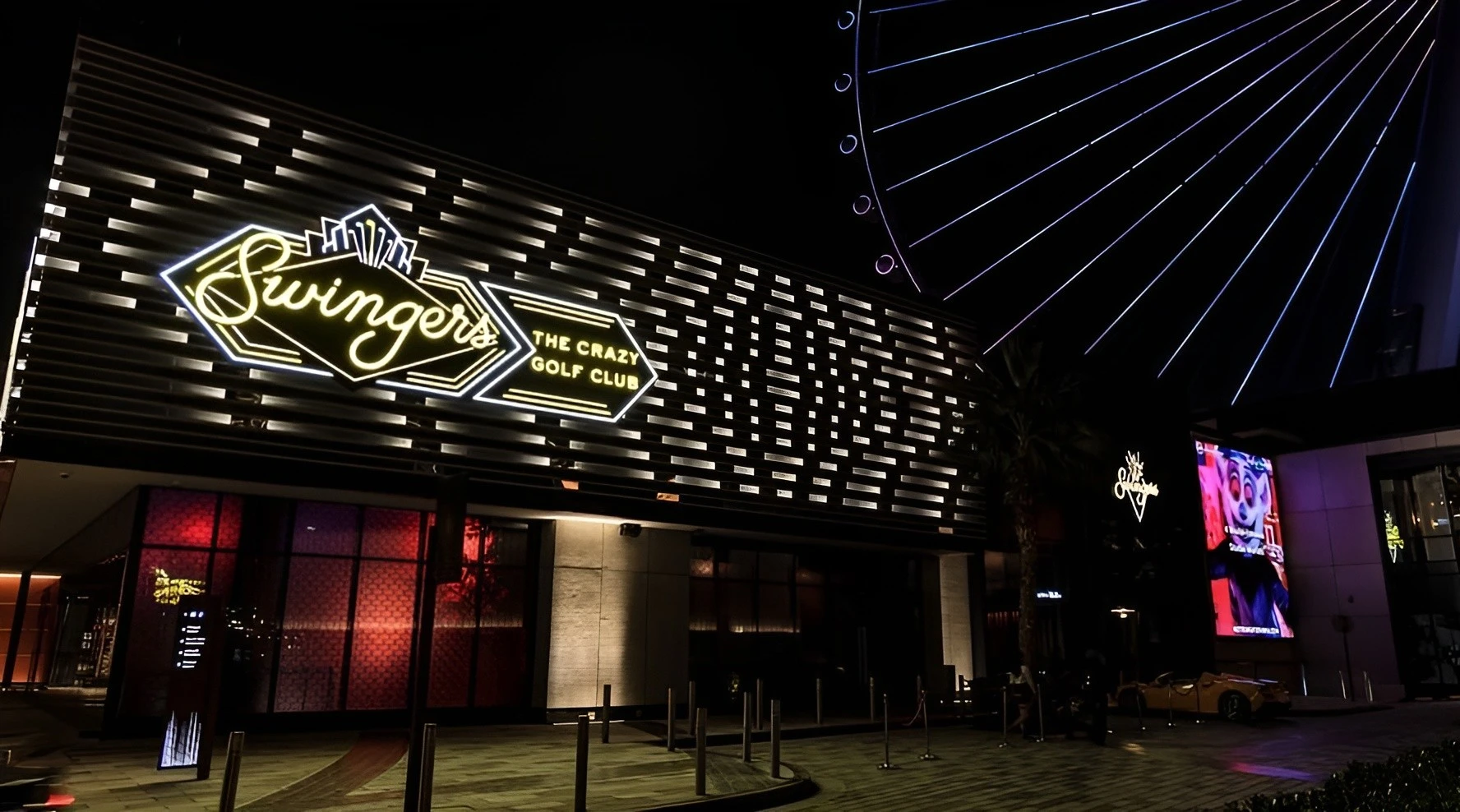 Swingers The Crazy Golf Club Dubai entrance at night.