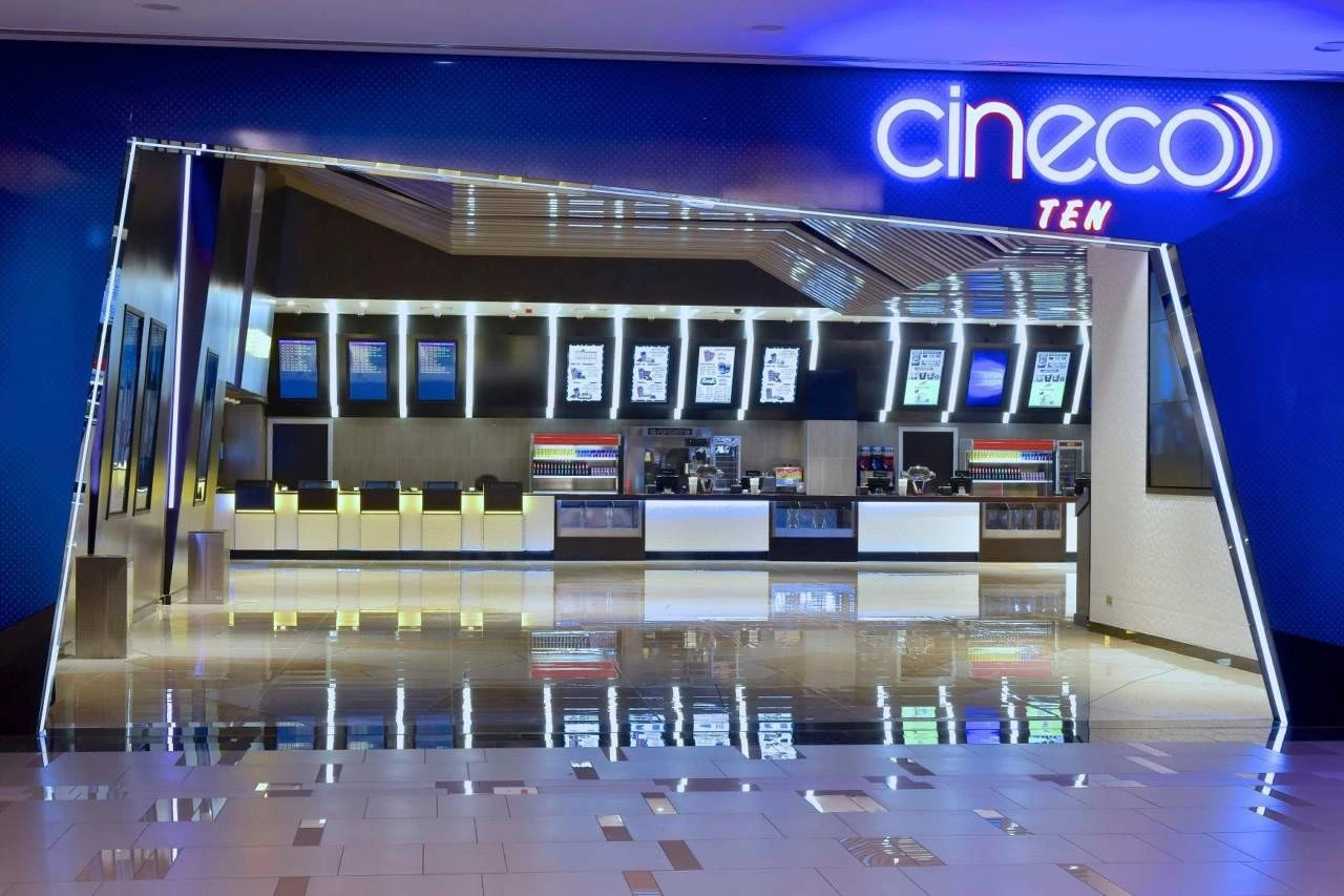 Oasis Mall Cinema Juffair entrance with illuminated ticket counter, Manama.