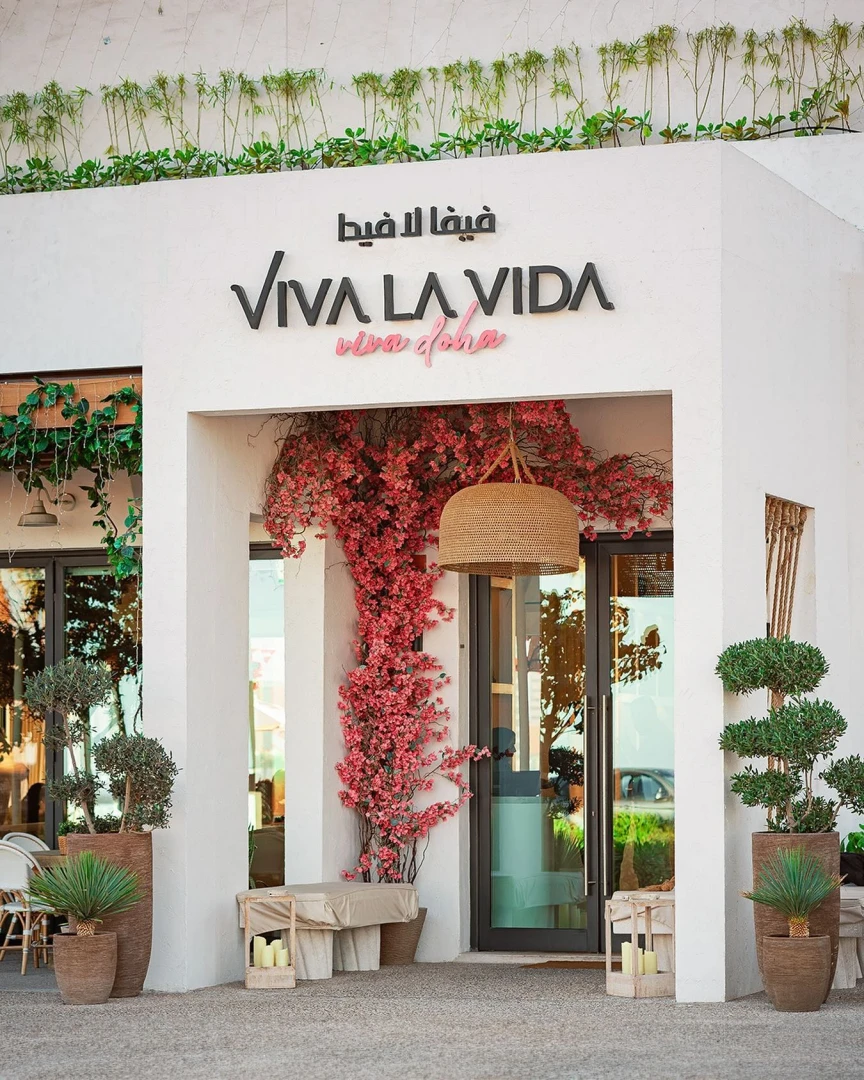 Viva La Vida Doha entrance with pink flowers, Lusail.