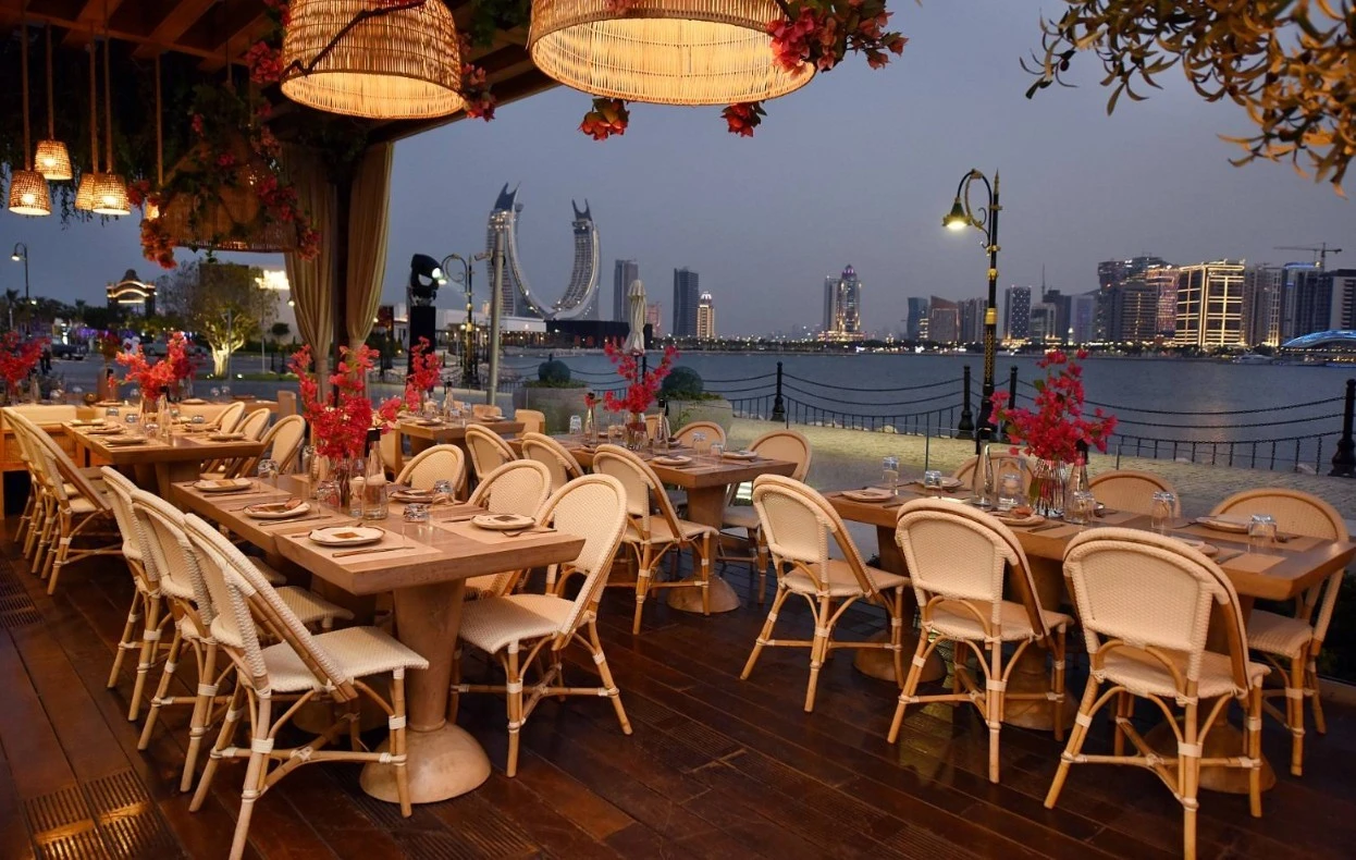 Viva La Vida Doha outdoor dining with Lusail skyline view.