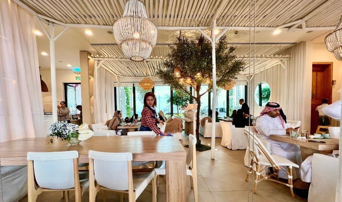 Elegant interior of Viva La Vida Doha, Lusail with dining guests.