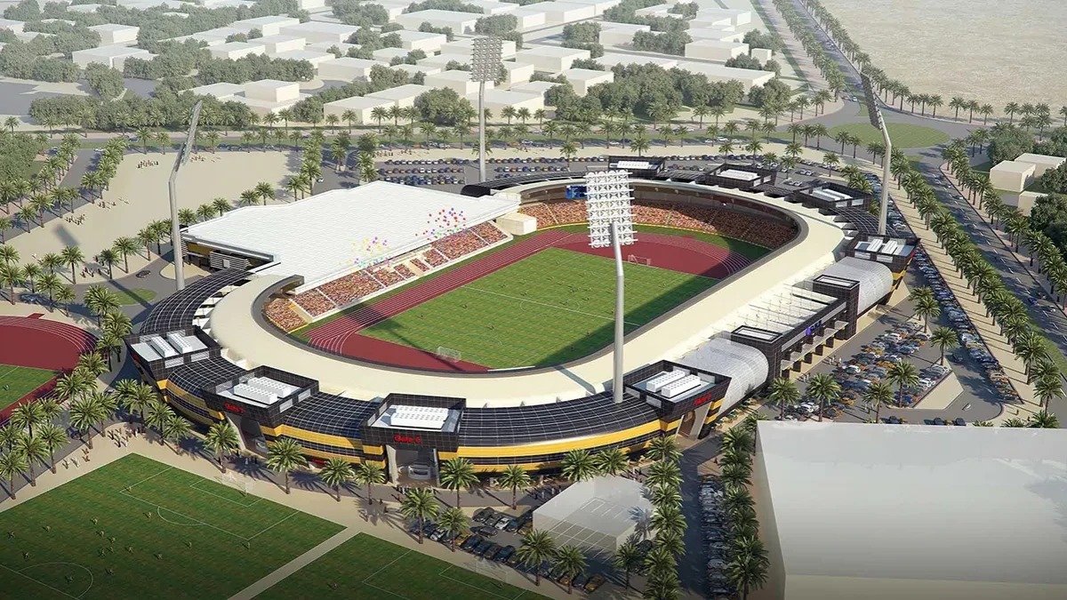 Aerial view of Suheim Bin Hamad Stadium, Doha, surrounded by palm trees.