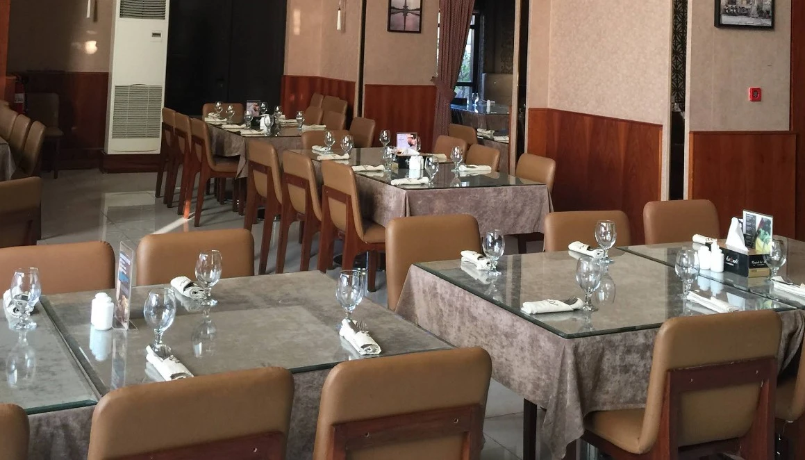 Interior of Nayaab Haandi Pakistani Restaurant, Dubai, with set tables.