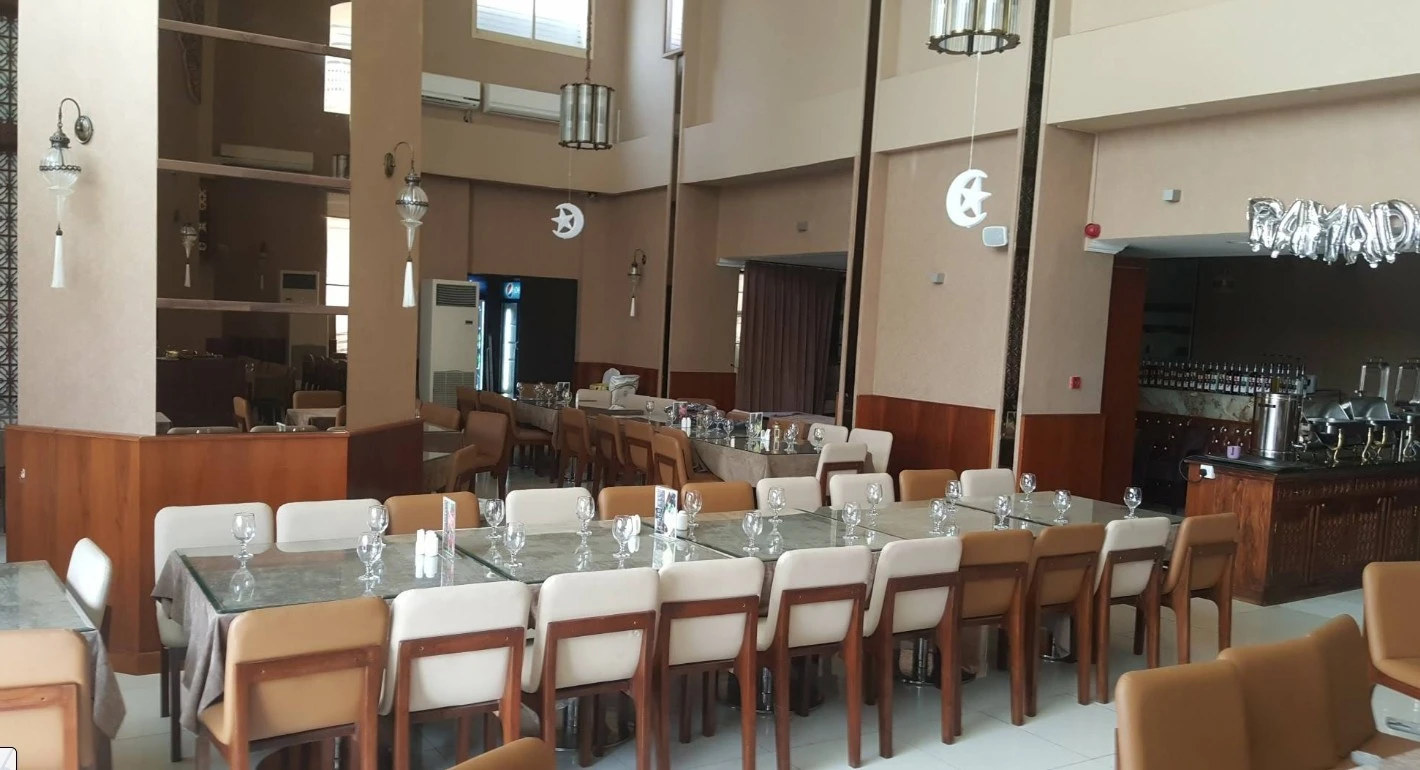 Spacious dining tables with glassware at Nayaab Haandi, Dubai.