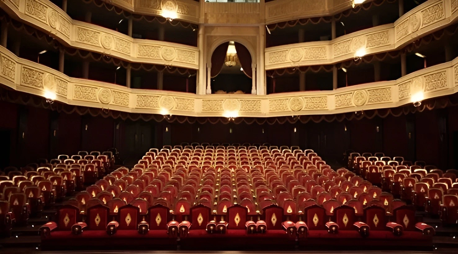 Interior of Katara Opera House, Doha, with ornate balconies and seating.
