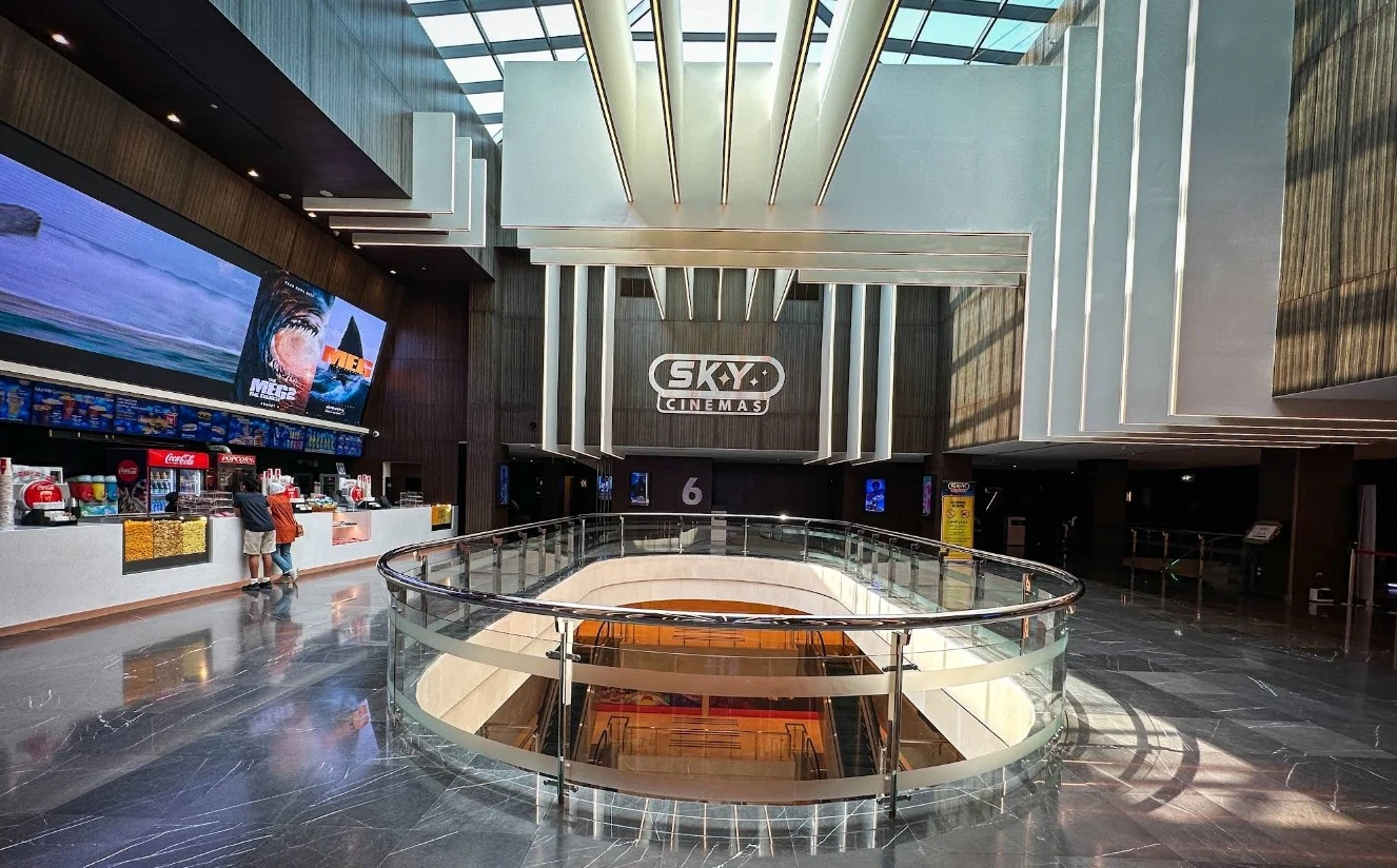 Sky Cinema Kuwait City interior with modern design and concession stand.