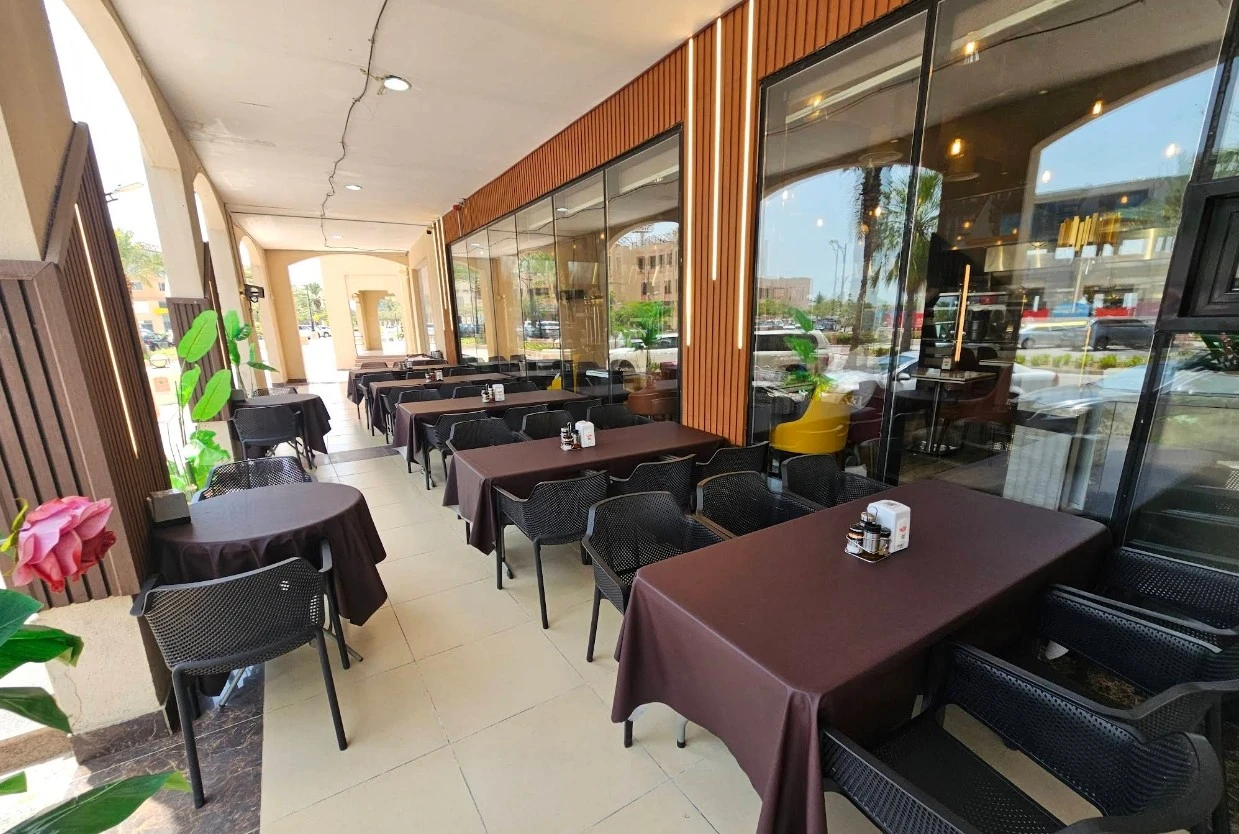 Outdoor seating at Grillo Restaurant Fanateer, Al Jubail.